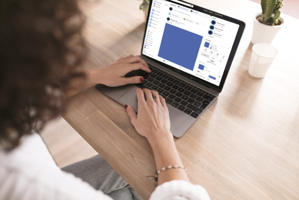 Person using Facebook on a laptop