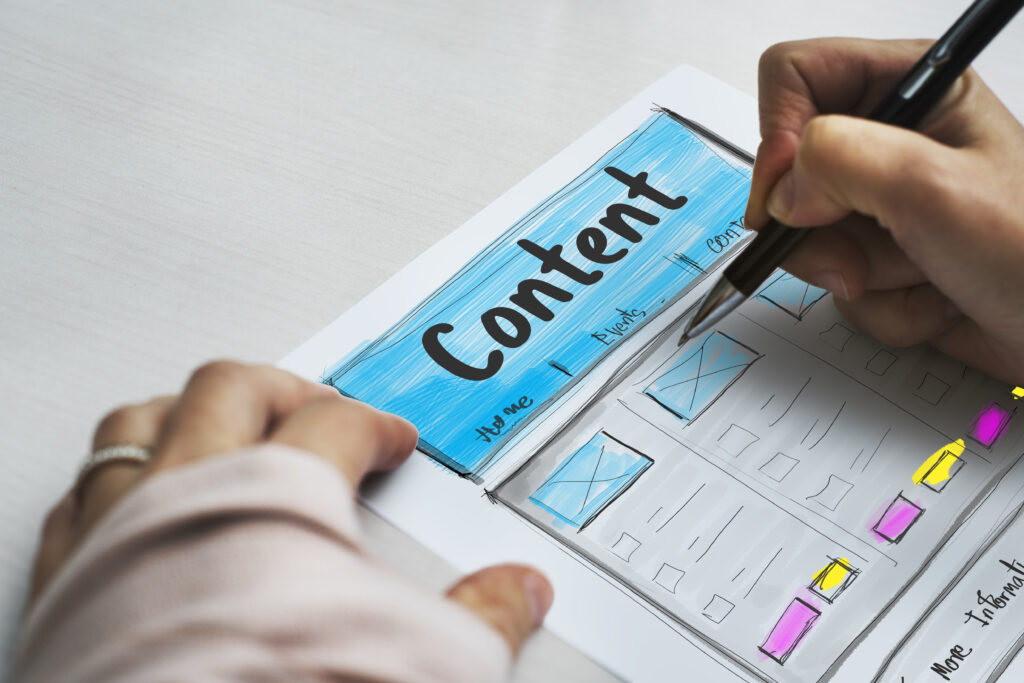Hand drawing a content layout on paper