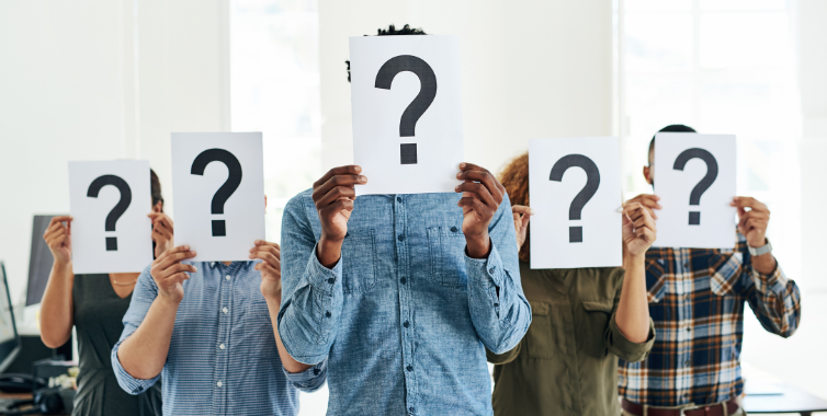 People holding a paper with question mark